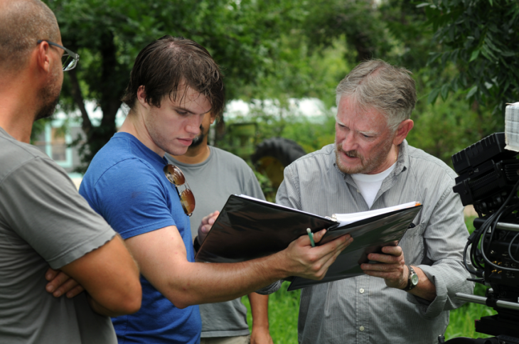 Script Supervisor Dan Delaney, a student at NMSU’s Creative Media Institute, brings director Rod McCall up to speed during filming.