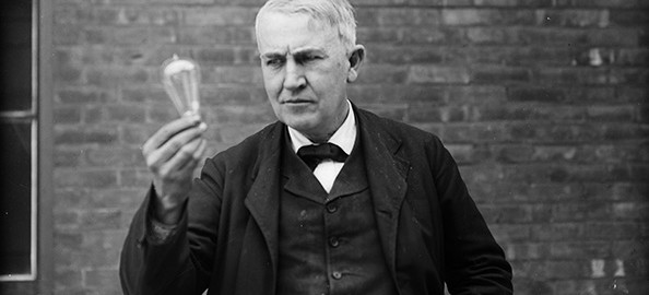 Thomas Alva Edison Holding a Lightbulb